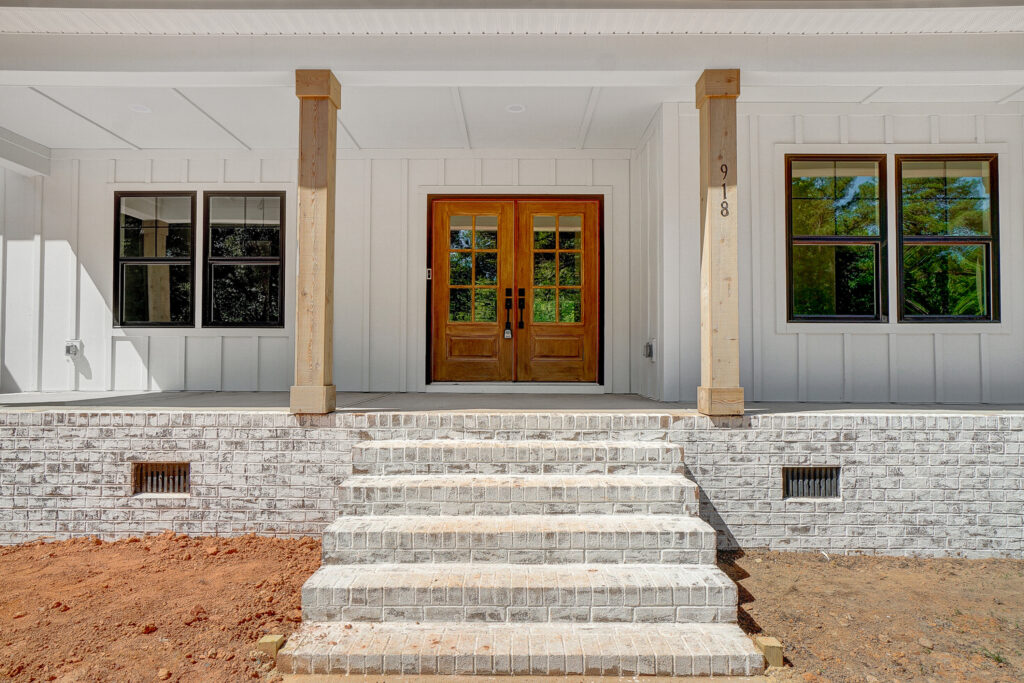 Crafted custom home entrance by Karrus Homes.